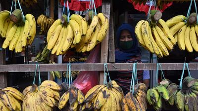 A vendor waits for customers at a market in Jakarta, Indonesia. AFP