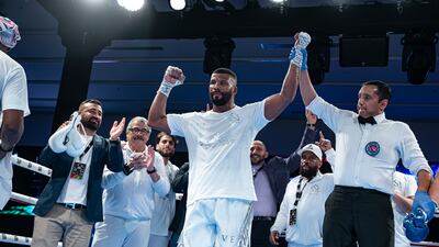 Badou Jack with his hand raised in victory.