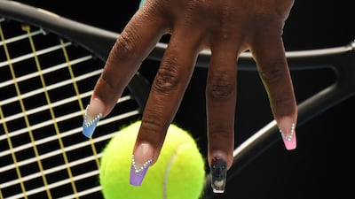 Serena Williams of the US practices her serve before her women's singles match against China's Wang Qiang in Melbourne. AFP