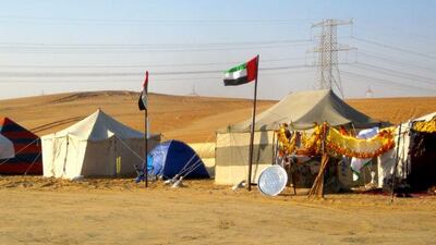 One of these things is not like the others. Women at the Al Dhafra festival can camp at the tack market with traveling families. Dec 2013.