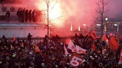 Demonstrators let off a flare at Place de la Bastille in Paris. Bloomberg