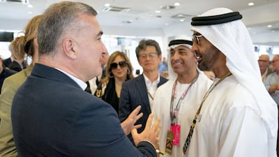 Sheikh Mohamed bin Zayed, Crown Prince of Abu Dhabi and Deputy Supreme Commander of the UAE Armed Forces (R), speaks with Elin Suleymanov, Azerbaijan Ambassador to the United States (L), at the Paddock Club on the final day of the 2018 Formula 1 Etihad Airways Abu Dhabi Grand Prix, at Yas Marina Circuit. Seen with Yousef Al Otaiba, UAE Ambassador to the USA and Mexico (2nd R). Hamad Al Kaabi / Ministry of Presidential Affairs