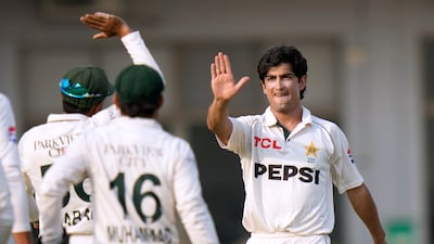 Pakistan's Naseem Shah, right, celebrates with teammates after taking the wicket of England's Ollie Pope for a duck. AP