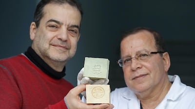 Samir Constantini, left, and Hassan Harastani, the master soap maker, who fled Syria and decided to produce Aleppo soap on French soil. Christian Hartmann / Reuters