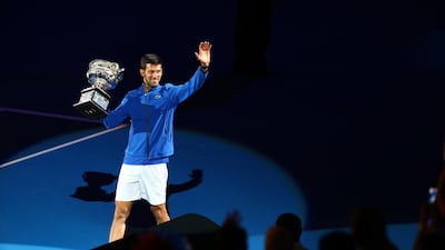 Novak Djokovic takes part in a lap of honour after his win. Getty Images