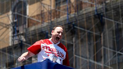 Mr Chestnut makes a grand entrance at the Nathan’s Famous Fourth of July hot dog eating contest in Coney Island. AP