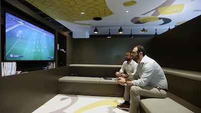 Employees play games at the Google office in Dubai. Satish Kumar / The National