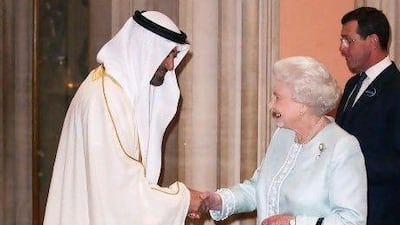 Britain's Queen Elizabeth II (R) greets Crown Prince of Abu Dhabi Mohammed bin Zayed al Nayan, upon his arrival at Windsor Castle, west of London, on May 18, 2012, for a Sovereign's Jubilee Lunch hosted by Britain's Queen Elizabeth II. A glittering lunch for the world's sovereigns to be held today to celebrate the diamond jubilee of Britain's Queen Elizabeth II has been marked by a withdrawal and protests over the guest list. AFP PHOTO / POOL / Dominic Lipinski *** Local Caption *** 546149-01-08.jpg