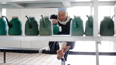 A Hui Muslim man performs ablution before entering the Nanguan Mosque in Yinchuan, China. Sarah Dea / The National