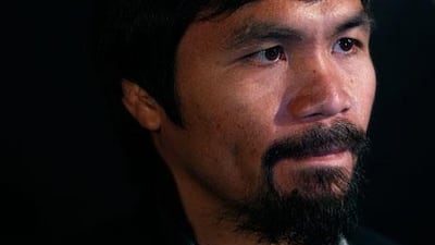 Manny Pacquiao's boxing record stands at 54 wins, five losses and two draws. Tyrone Siu / Reuters