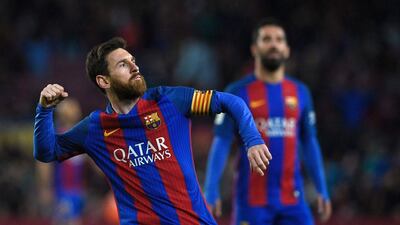 Barcelona's Lionel Messi celebrates after scoring one of his two goals against Osasuna at the Camp Nou stadium in Barcelona on April 26, 2017. Barcelona won 7-1. Lluis Gene / AFP