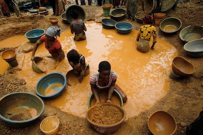 Prospectors pan for gold. The yellow metal is crucial to the state's economy. Luc Gnago/Reuters