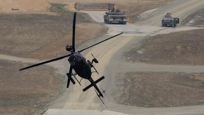 A Kiowa Warrior helicopter hovers during the United States and South Korean Joint live fire Exercise at Rodriguez Range in Pocheon, South Korea. Chung Sung-Jun / Getty Images