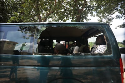 Recaptured inmates sit inside a prison vehicle in Abuja, Nigeria, on July 6. Boko Haram gunmen are suspected of attacking the Kuje Medium Prison. EPA