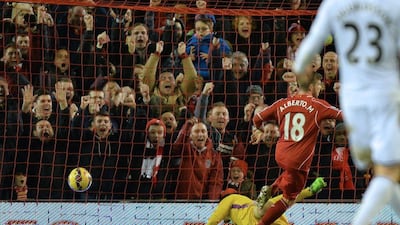 Liverpool's Alberto Moreno scores the opening goal in the club's Premier League win against Swansea City on Monday. Peter Powell / EPA