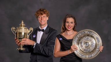 LONDON, ENGLAND - JULY 12: (EDITOR'S NOTE: This handout is a composite image, provided by a third-party organization and may not adhere to Getty Images' editorial policy) Men's singles champion Jannik Sinner and women's champion Linda Noskova pose with the Gentlemen's Singles Trophy and the Venus Rosewater Dish at the Champion's Dinneron day fourteen of The Championships Wimbledon 2026 at All England Lawn Tennis and Croquet Club on July 12, 2026 in London, England. (Photo by AELTC / Andrew Baker via Getty Images)