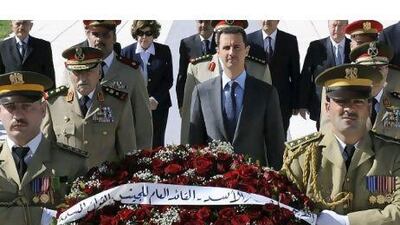 Syrian President Bashar Assad, centre, has responded harshly to anti-regime protesters. AP Photo