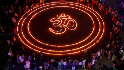 People light lamps as they make a formation of 'Om', a spiritual icon for Hindus, on the eve of Diwali, in Chandigarh, India. Reuters