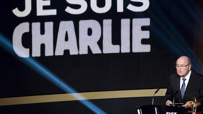 Fifa president Sepp Blatter delivers a speech on Monday evening at the Ballon d'Or gala in Zurich as the words ‘Je suis Charlie’ (I am Charlie) are seen on a huge screen to commemorate the victims of last week's terrorist attack in Paris. EPA Photo