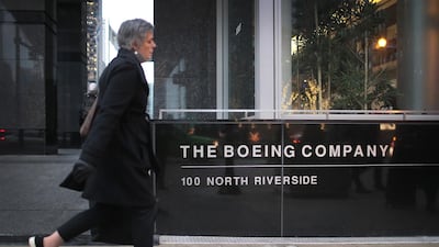 A pedestrian walks by the headquarters of the plane maker Boeing on January 29, 2020 in Chicago, Illinois. Boeing said costs associated with grounding the 737 Max aircraft were expected to exceed $18 billion. Getty Images