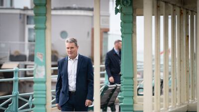 Keir Starmer walks along Brighton seafront promenade. This is Mr Starmer's first conference as Labour Party leader. PA