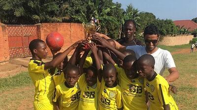 Salem Alkarbi hosts events for disadvantaged children worldwide through his football charity "Beyond the Boundaries of Football". Here he is in Uganda. Courtesy Salem Alkarbi