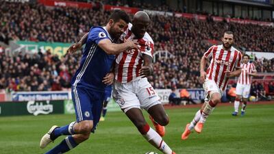 Chelsea striker Diego Costa, left, vies with Stoke City's Bruno Martins Indi during the English Premier League football match at the Bet365 Stadium in Stoke-on-Trent, central England on March 18, 2017. Oli Scarff / AFP