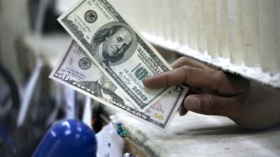 Above, US dollar notes. Many factors have contributed to the rise in demand for $100 bills from the 1990s, including the generalised fall in interest rates and growing demand from emerging markets. Romeo Ranoco / Reuters