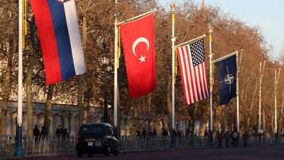 London taxi drives past NATO and members' flags ahead of Nato Summit in London, Britain December 2, 2019 REUTERS/Yves Herman