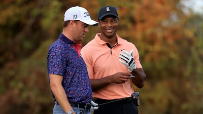 Tiger Woods and Justin Thomas wait on the 18th hole. AFP