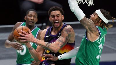 Abdel Nader tries to go up for a shot against the Dallas Mavericks. AP Photo