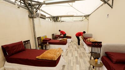 .Workers set up accommodation for pilgrims in Mina.