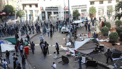 Lebanese security forces intervene after counter-protesters clash with anti-government demonstrators destroy a protest site in the centre of the capital Beirut during the 13th day of anti-government demonstrations. AFP