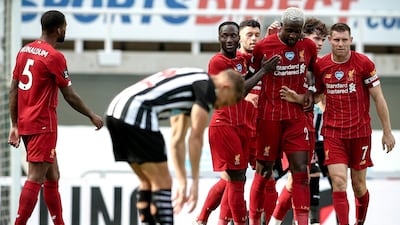 Divock Origi - 7: Had done very little up against a makeshift Newcastle defence before curling home a lovely goal just before the hour mark. EPA