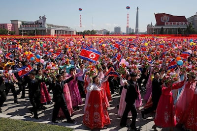Participants march during the parade for the 70th anniversary of North Korea's founding day in Pyongyang. AP