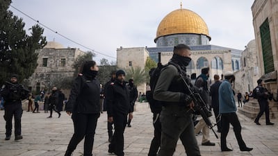 Israeli police escort Jewish visitors through Al Aqsa Mosque compound in Jerusalem. AP