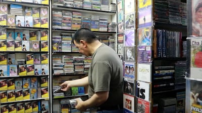Shelves filled with CDs, cassettes and vinyl records hark back to the days before download dominance. Wajod Alkhamis / The National
