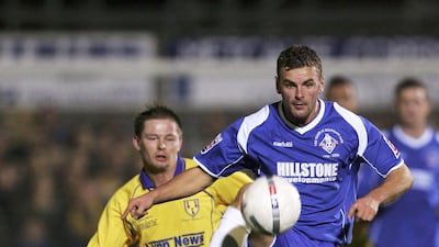 Richie Wellens, right, during his playing days at Oldham Athletic. He was installed as the club's new manager on Wednesday following a run of four wins and one draw from his first five game sin caretaker charge. Matthew Lewis / Getty Images