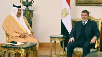 Egyptian president Mohammed Morsi (right) meets with Qatari prime minister and foreign minister Hamad bin Jassim Al Thani. Qatar is to increase its financial aid to Egypt by $2.5 billion.