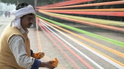 TOPSHOT - A man prepares coloured kite strings ahead of Lohri, the spring festival in Amritsar on January 6, 2026. (Photo by Narinder NANU / AFP)