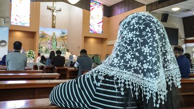 Prayers for Pope Francis at St Joseph's Cathedral in Abu Dhabi. Victor Besa / The National