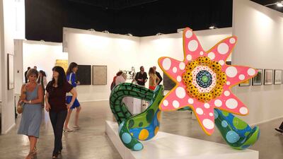 Visitor stroll through the booth from Victoria Miro Gallery, London