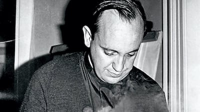 Jorge Mario Bergoglio serves a meal in Buenos Aires in this undated photo. AFP