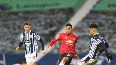 United's Mason Greenwood surrounded by West Brom players Matheus Pereira, right, and Conor Townsend. AP