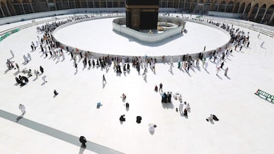 Muslim worshippers circumambulate the sacred Kaaba in Mecca's Grand Mosque, Islam's holiest site. Saudi Arabia reopened the area around the Kaaba. AFP