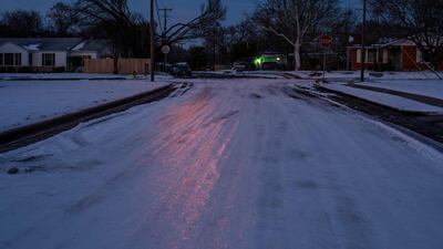 Ice and snow covers a street in Waco, Texas, after a winter storm that caused power cuts across the state. AFP