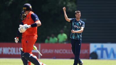 England bowler David Payne celebrates taking the wicket of Scott Edwards for 64. Getty