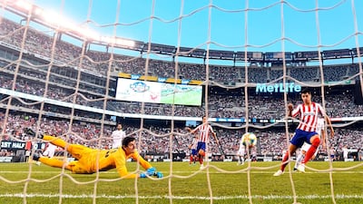 Atletico Madrid's Diego Costa scores his first of four goals against Real Madrid. AFP