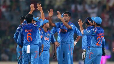 Ravichandran Ashwin of India is congratulated by his teammates after dismissing Hashim Amla during the ICC World Twenty20 semi-final against South Africa at Sher-e-Bangla Mirpur Stadium on April 4, 2014 in Dhaka, Bangladesh. Scott Barbour / Getty Images