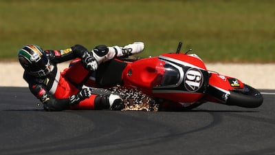 Alex Pons of Spain and the AGR team crashes during Moto2 warm up ahead of the 2015 MotoGP of Australia at Phillip Island Grand Prix Circuit in Phillip Island, Australia. Cameron Spencer / Getty Images